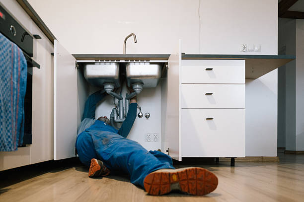 Professional Plumbing technician working in Montchanin, DE